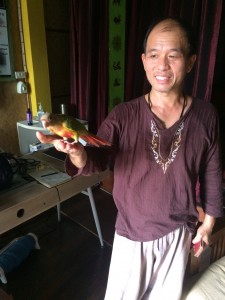 Chai with his pet bird